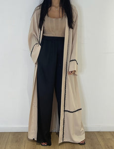 Pantalon en soie noire pour femme avec détail de contraste beige
