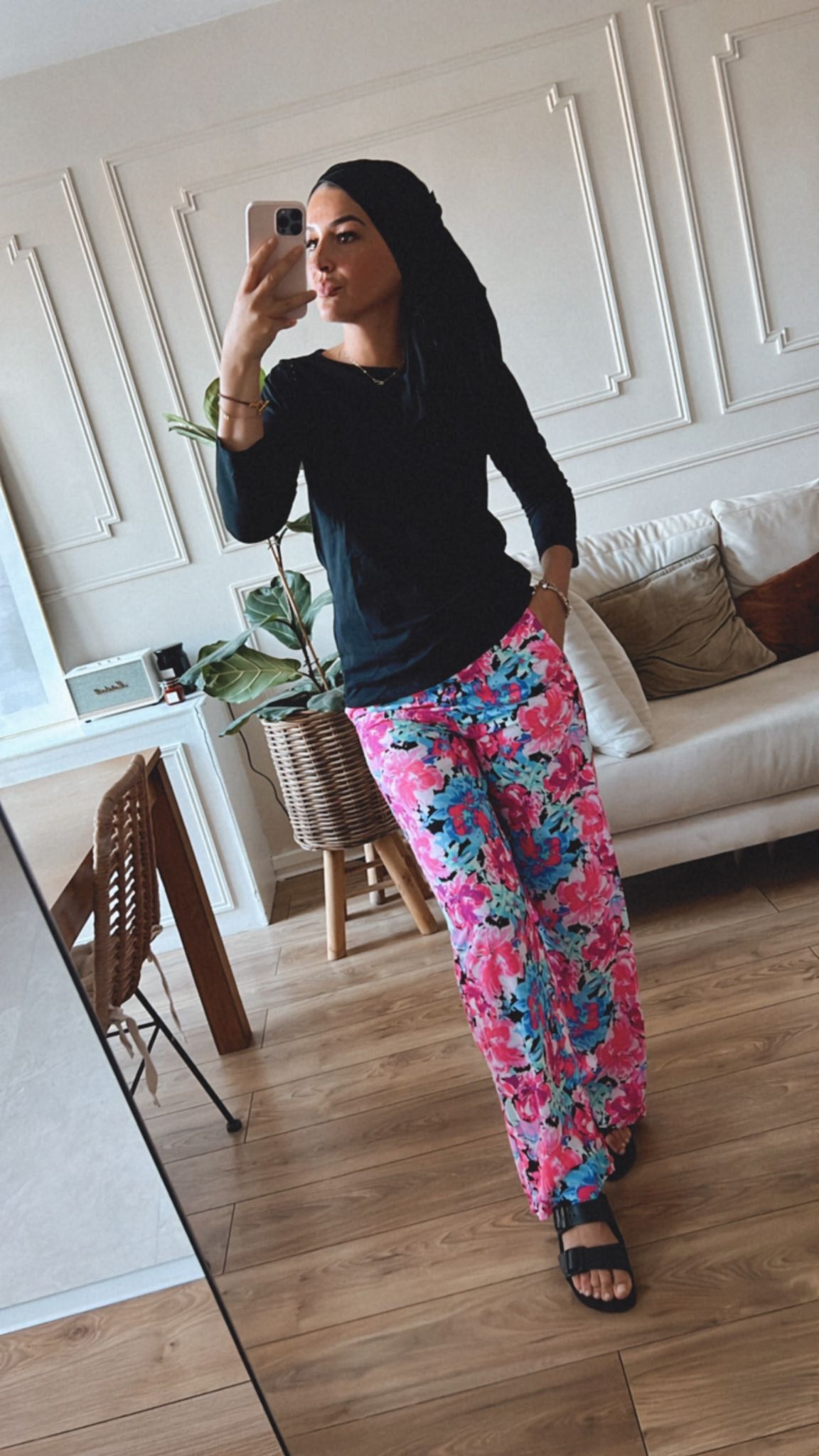 Pink floral trousers matched with an elegant black camisole